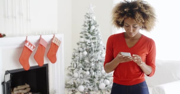 Woman checking Christmas messages — ストック動画