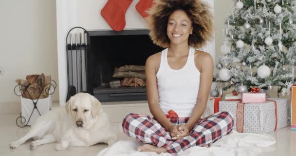 Woman celebrating Christmas with dog — Stockvideo