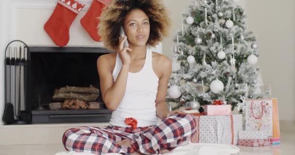 Woman phoning friends at Christmas — Stock Video