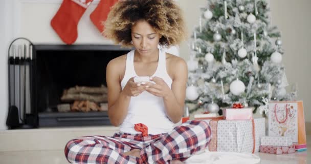 Woman sending Christmas message — Stockvideo