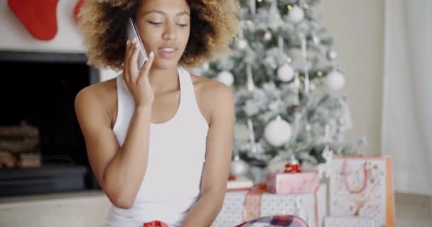 Woman making call at Christmas — Stockvideo