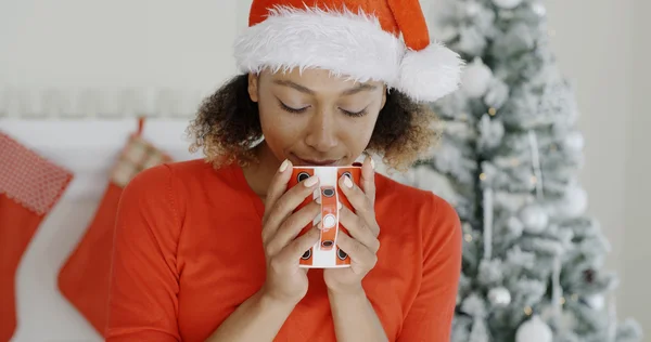 Woman enjoying hot coffee at Christmas — Stockfoto