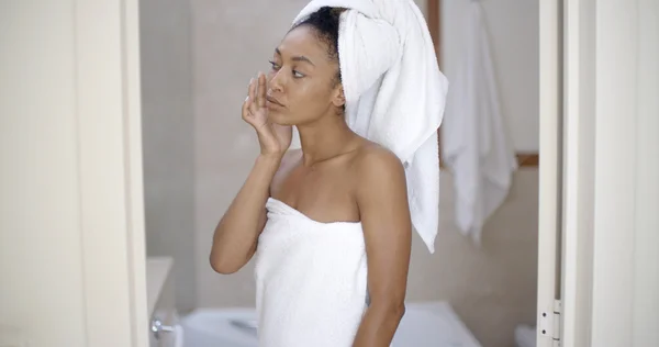 Woman looking on the mirror — Stock Photo, Image