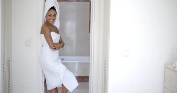 Woman with towel on head in bathroom — Stock Photo, Image