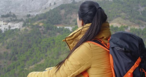 Female backpacker taking rest — Stockvideo