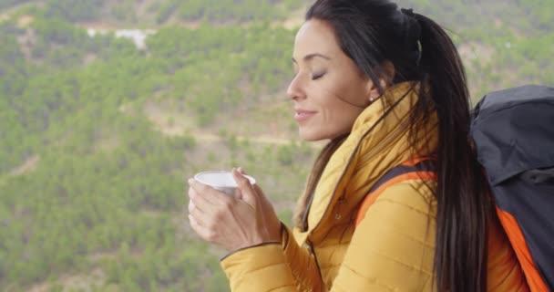 Woman savoring mug of hot coffee — Stockvideo