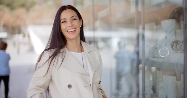 Woman standing outside store window — Stock Fotó