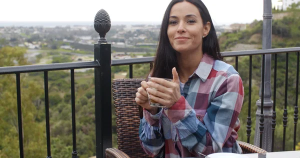 Woman relaxing outdoors with tea — ストック写真