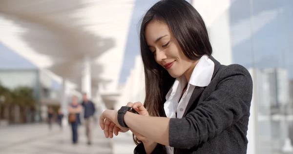 Woman checking wristwatch — Stock Photo, Image