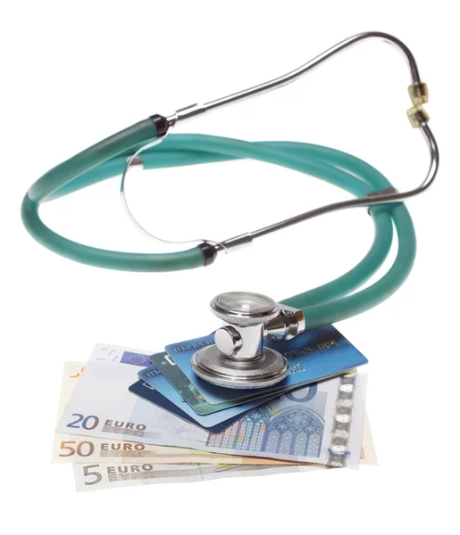 Stethoscope on the top of the money — Stock Photo, Image