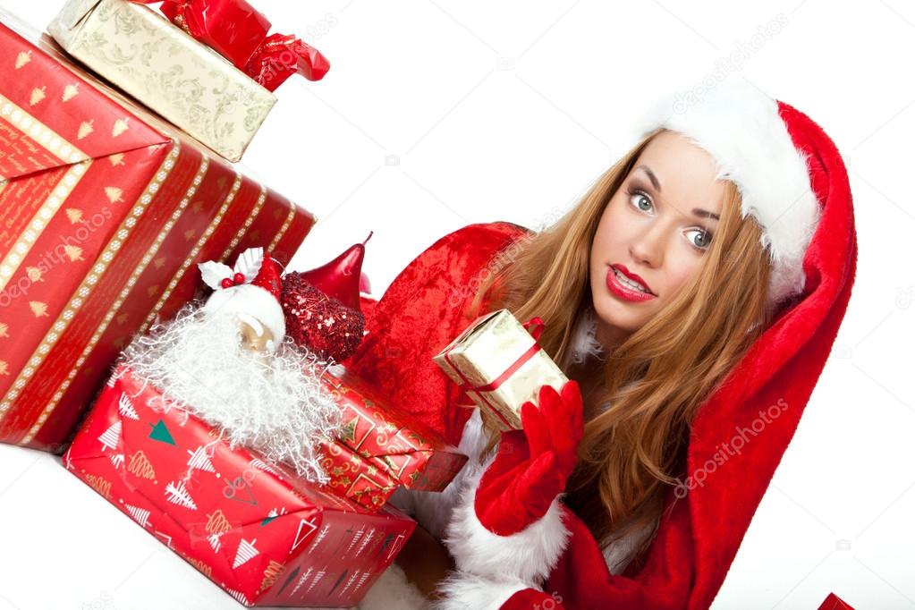 Smiling woman in santa helper hat with many gift boxes