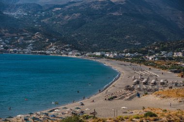view of the sandy beach in the bay near Plakias on the island of Crete in Greece