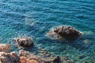 a section of the steep rocky coastline of the Mediterranean Sea on the island of Crete