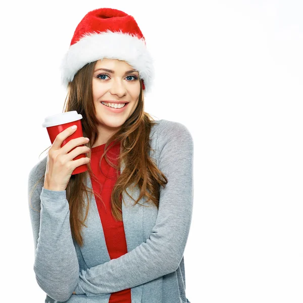 Vrouw in kerstmuts met een koffiekopje — Stockfoto