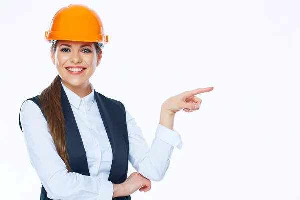 Жінка-будівельник вказує пальцем — стокове фото