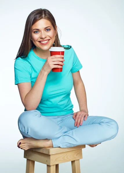 Woman holding red cup — Stock Photo, Image