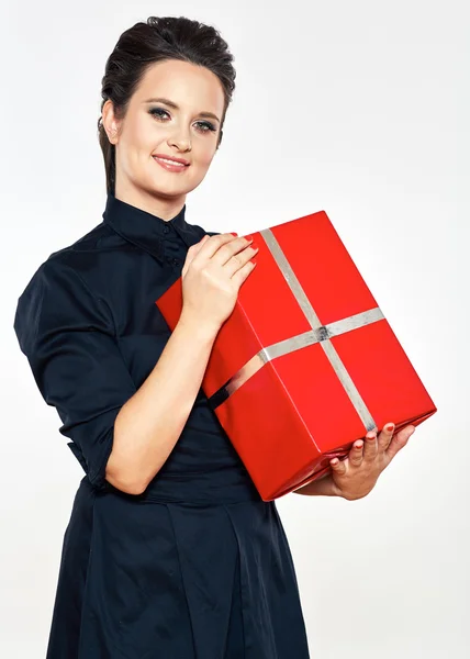 Woman holds red gift box — Stock Photo, Image