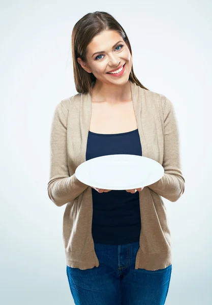 Frau zeigt leeren Teller — Stockfoto