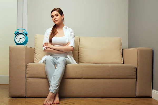 Woman Sitting Sofa Alarm Clock Wait Something — Stock Photo, Image