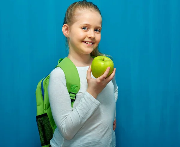 Schoolgirl Holding Big Green Apple Portrait Girl Backpack Blue Background — Stock Photo, Image