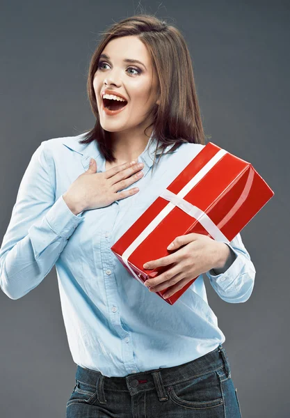 Surprised business woman hold red gift — Stock Photo, Image