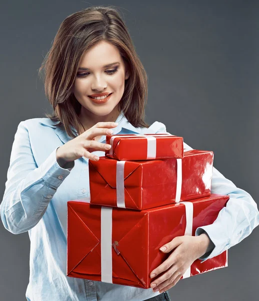 Woman holding red gift boxes. — Stock Photo, Image