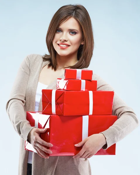 Smiling woman hold red gift boxes — Stock Photo, Image