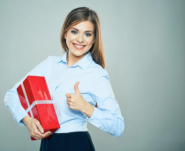 Businesswoman holding red gift box — Stock Photo, Image