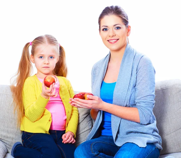 Mom gives girl red apples — Stock Photo, Image