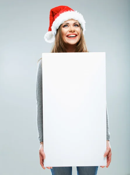 Woman in Santa hat with board — Stock Photo, Image