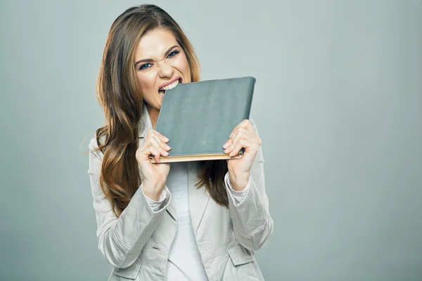 Beautiful bookkeeper biting book — Stock Photo, Image