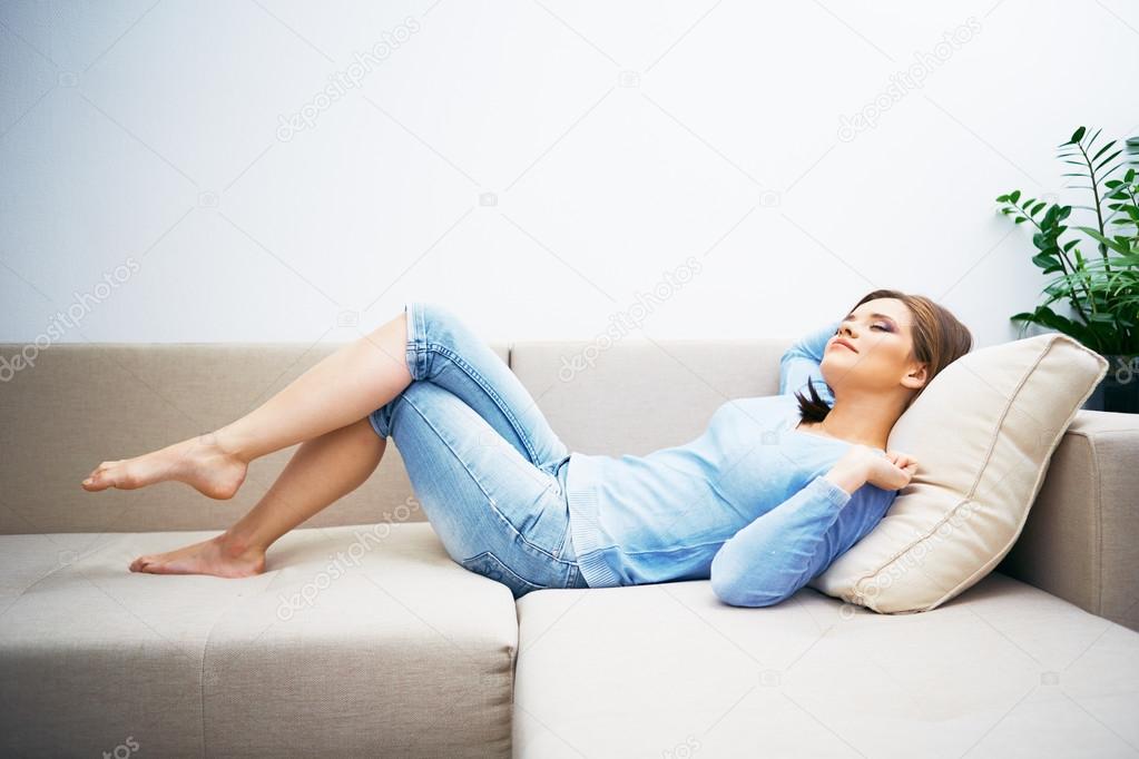 Young woman lying on sofa