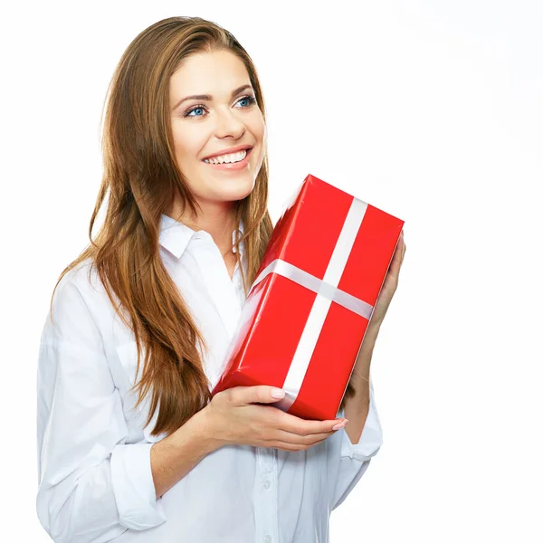 Smiling businesswoman holds red gift — Stock Photo, Image