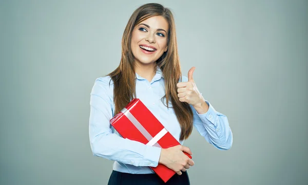 Woman with thumb up and gift box — Stock Photo, Image