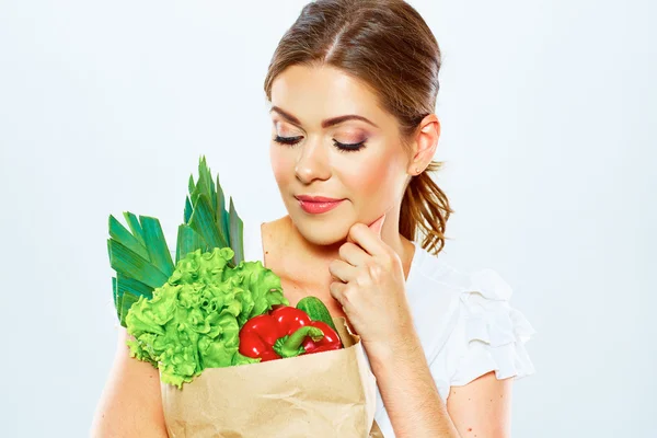緑色食品と考える女性 — ストック写真