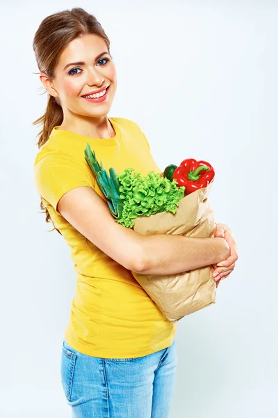 Woman with vegan food in bag — Stock Photo, Image