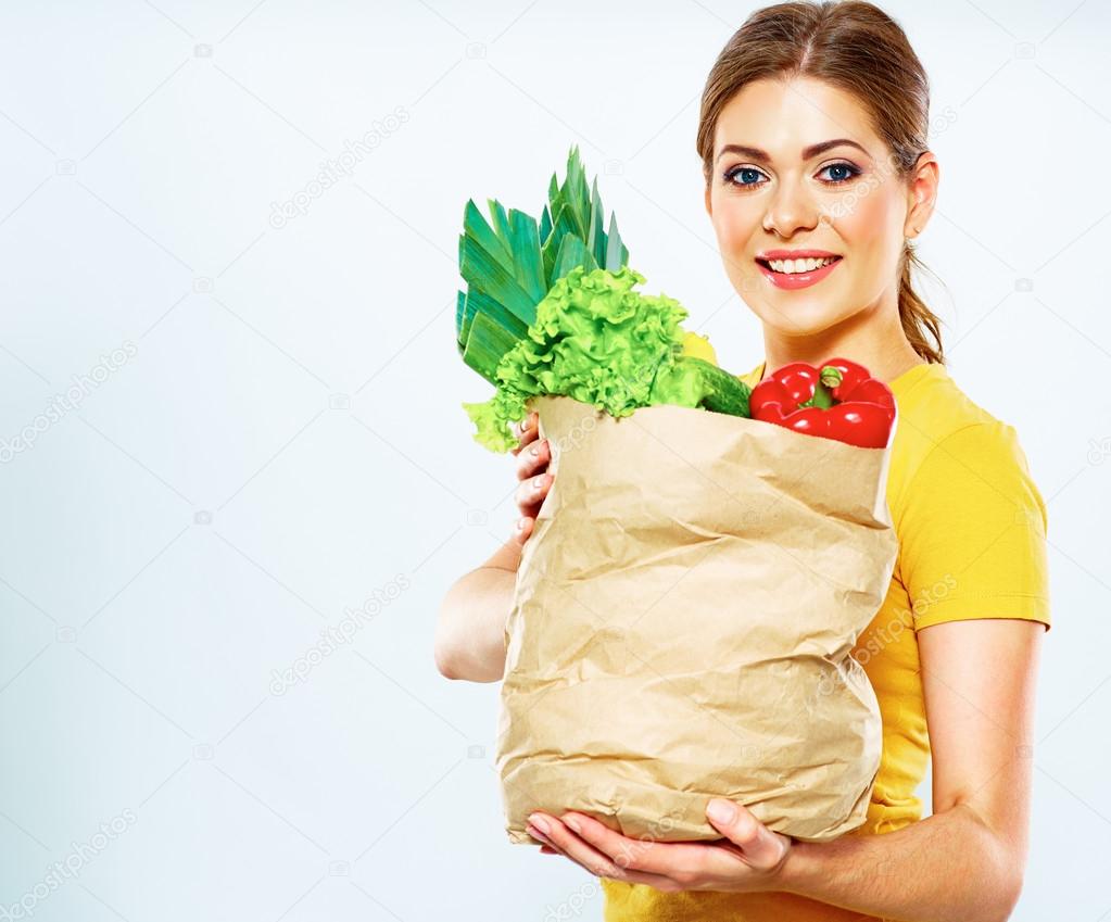 Woman with vegan food in bag