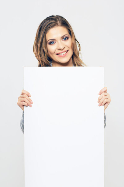 Woman holding blank poster