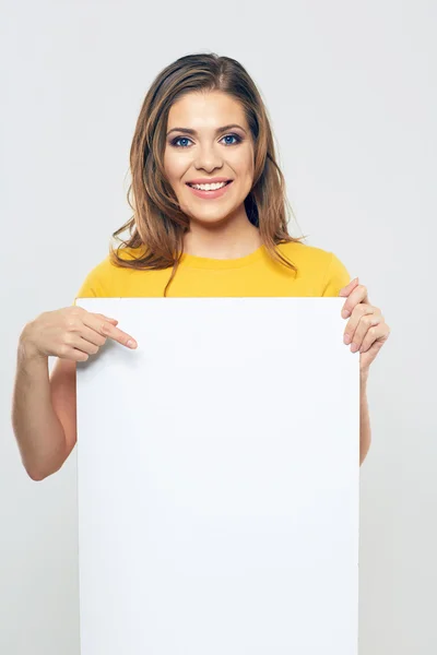 Woman pointing at board — Stock Photo, Image