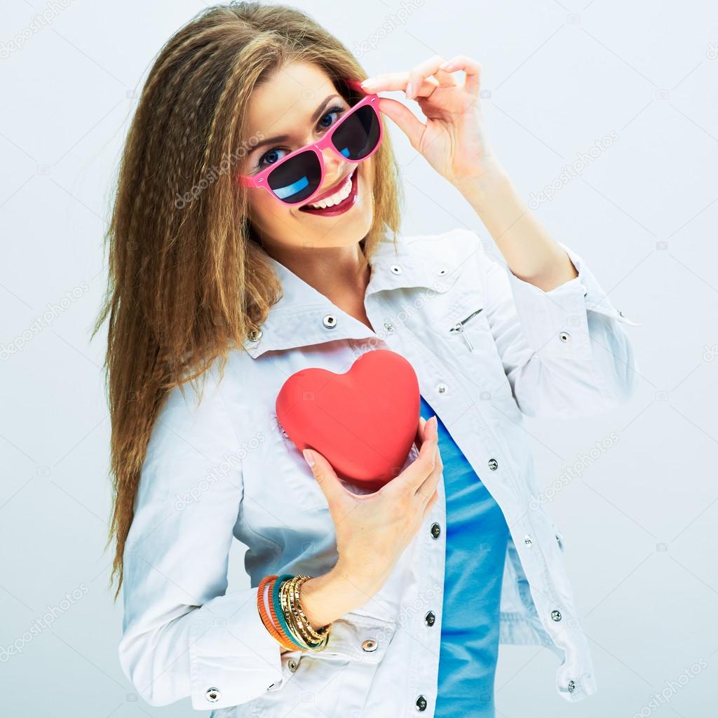 Woman holds red heart