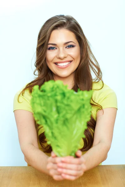 Woman holds green lettuce — Stock Photo, Image