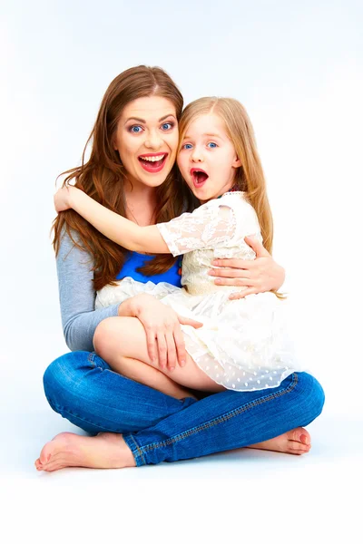 Little girl and mother hugging — Stock Photo, Image