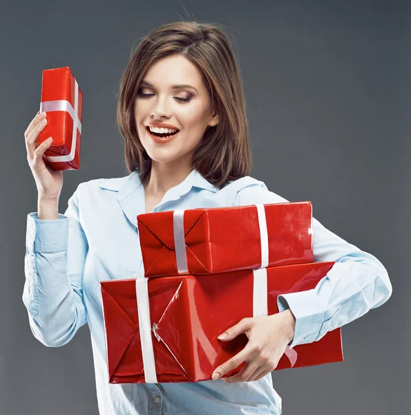 Businesswoman holds red gift boxes — Stock Photo, Image