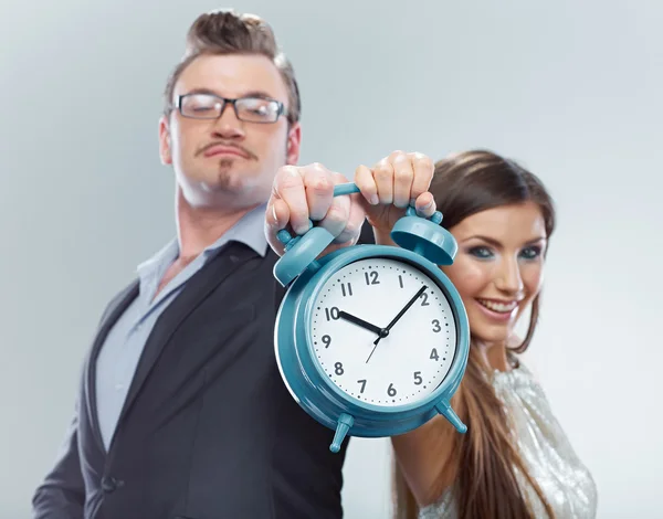 Businesswoman and businessman hold watch — Stock Photo, Image