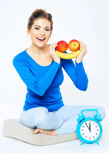 Woman with fruits and clock — Stock Photo, Image