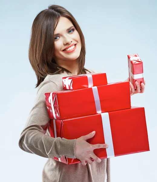 Woman holds red gift boxes — Stock Photo, Image