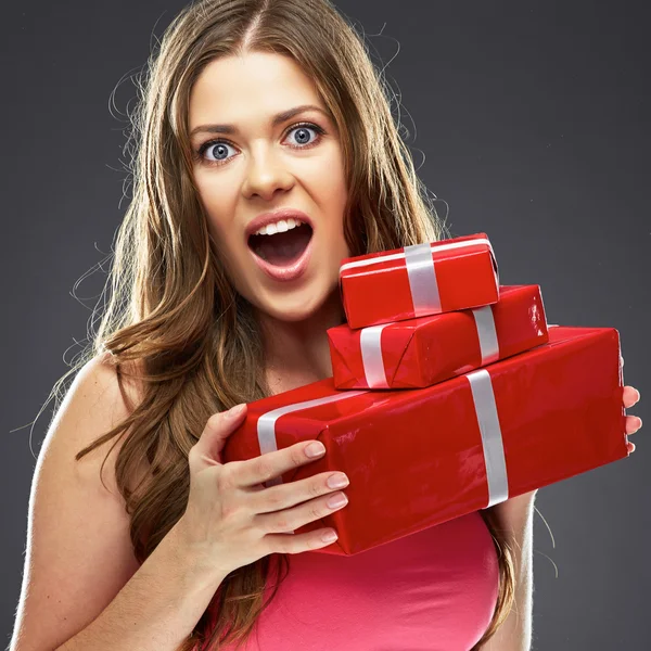 Woman holding red gift boxes — Stock Photo, Image