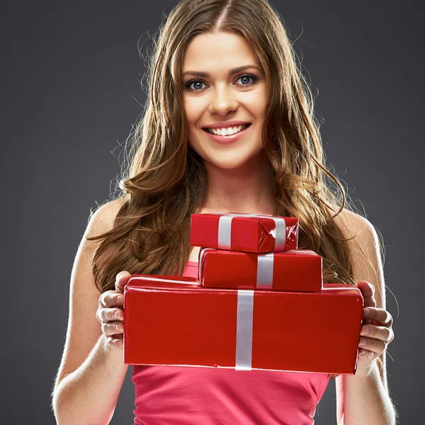 Woman holding red gift boxes — Stock Photo, Image