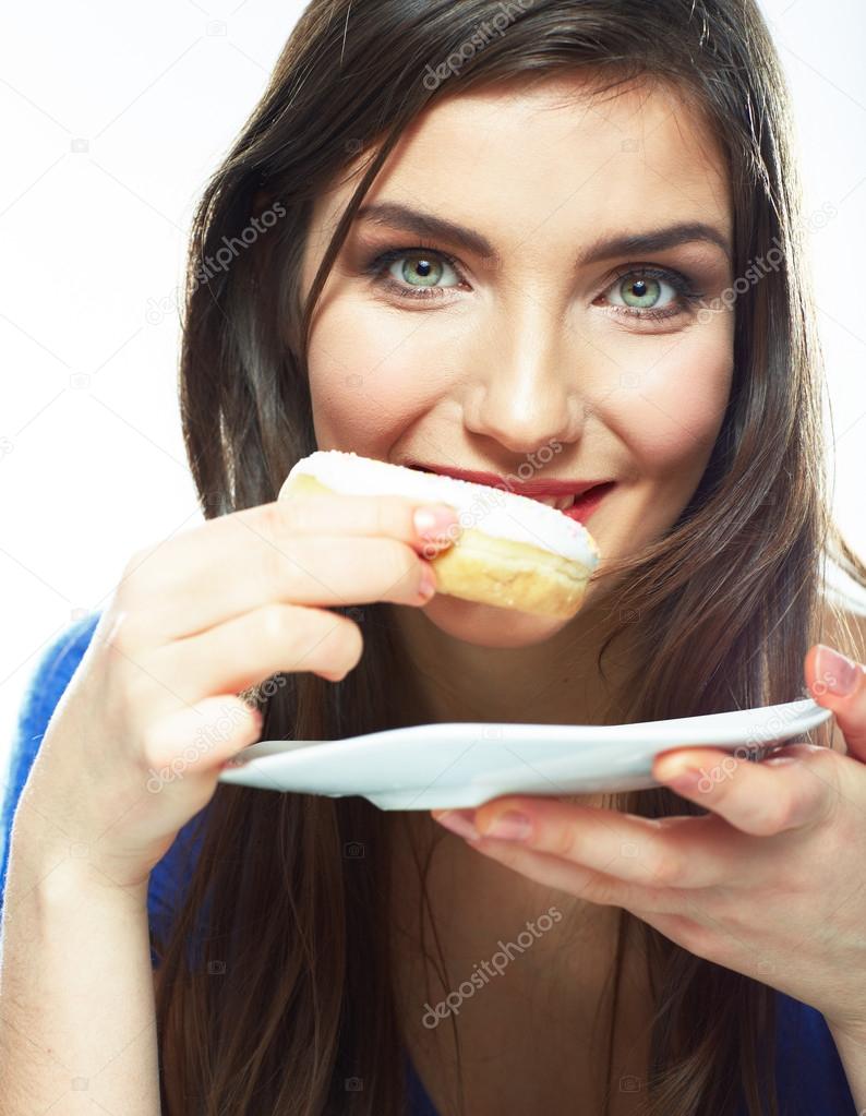 Woman eating donut