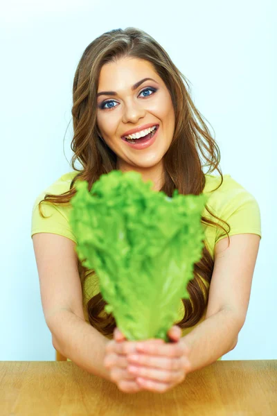 Woman holds green lettuce — Stock Photo, Image